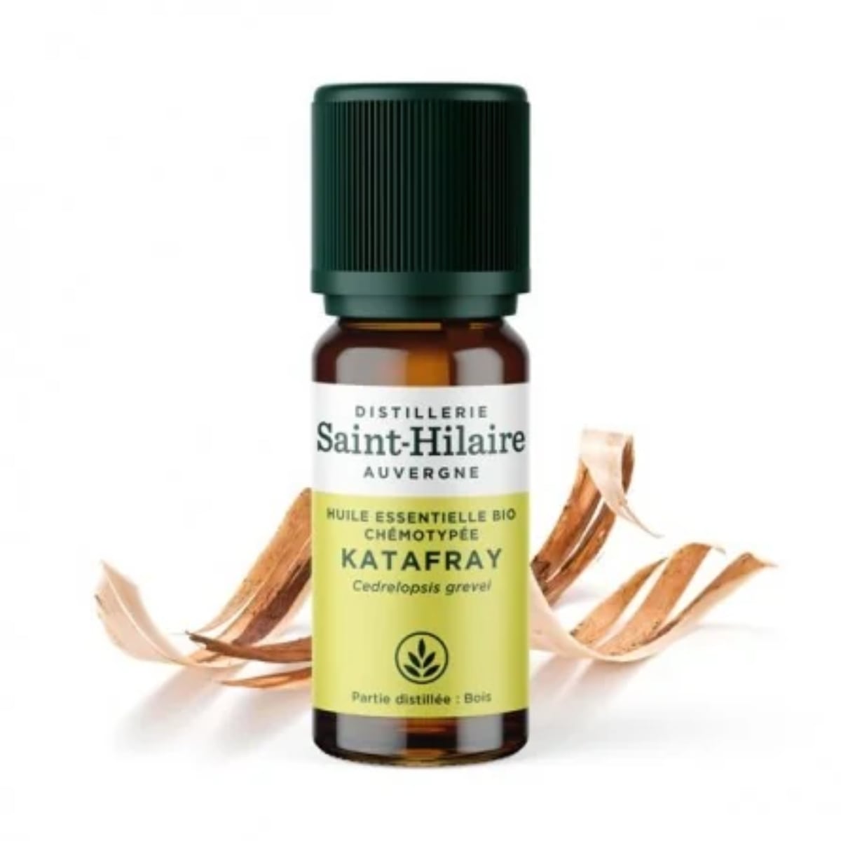 Un flacon de 10ml d'huile essentielle de Katafray de la distillerie Saint-Hilaire accompagné de fleurs de Katafray en arrière plan.