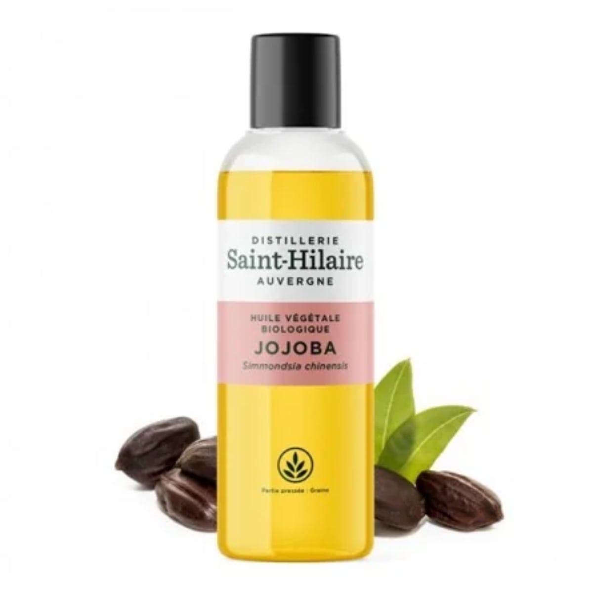 Un flacon d'Huile Végétale de Jojoba Bio de la distillerie Saint-Hilaire en 200ml accompagné de fèves de jojoba en arrière plan. 